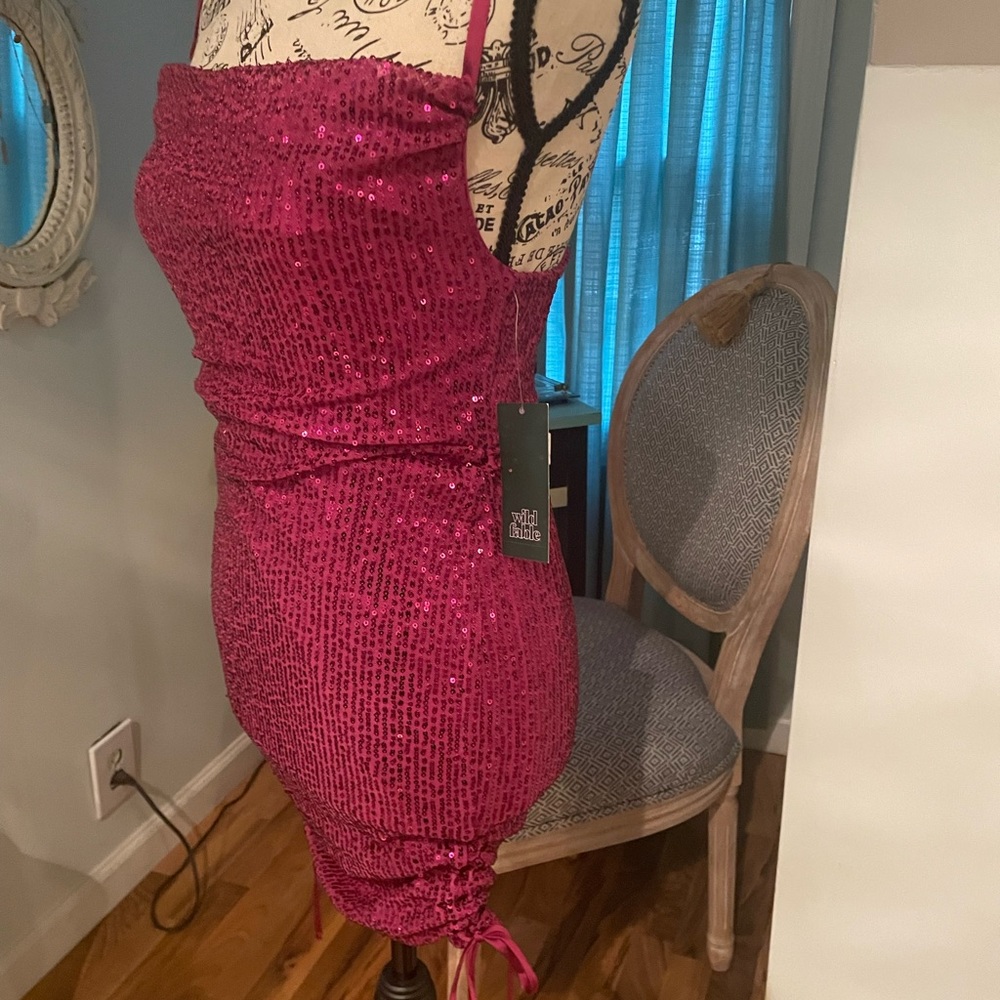 Beautiful sequin dress with spaghetti straps. Brand new with tag..